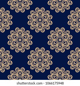 Golden floral ornament on dark blue background. Seamless pattern for textile and wallpapers