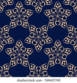 Golden floral ornament on dark blue background. Seamless pattern for textile and wallpapers