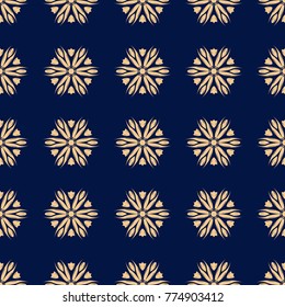 Golden floral ornament on dark blue background. Seamless pattern for textile and wallpapers