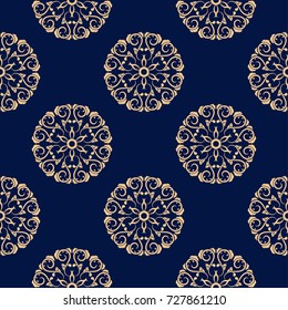 Golden flowers on blue background. Seamless pattern for textile and wallpapers