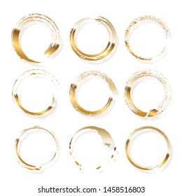 Golden frames made of brush stroke rings isolated on white background. Vector design elements set