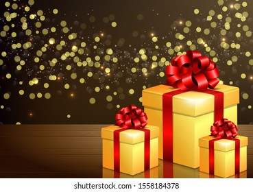 Golden gift boxes with red bow and ribbon