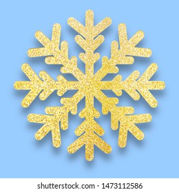 Golden glitter textured eight-rayed snowflake isolated on blue background. Gold Christmas Snow flake  