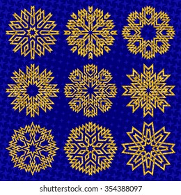 Golden glittering snowflakes on blue starry background. Winter holiday greeting card design elements.