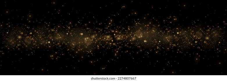 Golden glitter.Light effect.Glittering particles background. Gold dust on a transparent background.