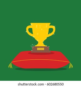 golden glowing Vector Trophy Cup emblem Icon in football or soccer sport. Winning symbol illustration on green flat design on a pillow or cushion. 