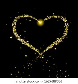 Golden heart of flying particles on black background