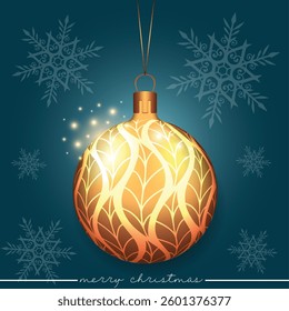 A golden holiday bauble adorned with an elegant leaf motif on blue backdrop featuring a snowflake pattern.