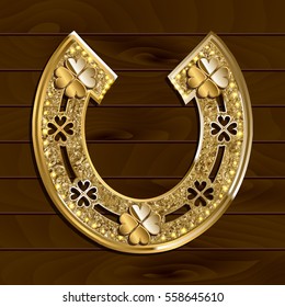 Golden horseshoe with four-leaf clover on wooden background. Vector illustration