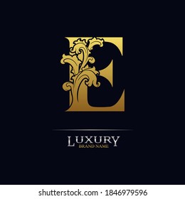 Golden initial letter E with floral leaves. Luxury Natural Logo Icon. Elegant botanic design. Modern alphabet with branch ornament for monogram, emblem, initial, label, brand, business, greeting cards