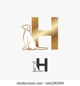 golden initial letter H with dog 