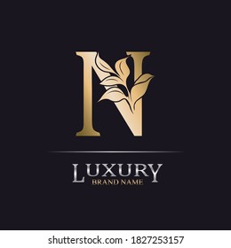 Golden Initial Letter N. Elegant design letter N with floral branch. Luxury Gold Logo Icon. Vintage alphabet concept with floral ornate for monogram, initial, heraldy, logo, business, wedding card.