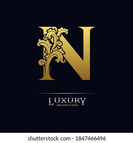 Golden initial letter N with floral leaves. Luxury Natural Logo Icon. Elegant botanic design. Modern alphabet with branch ornament for monogram, emblem, initial, label, brand, business, greeting cards