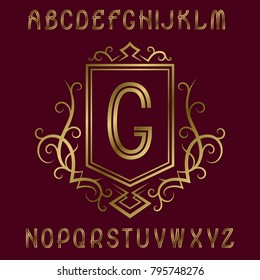 Golden initial monogram template in wreath with shield. Graceful letters and logo design elements.