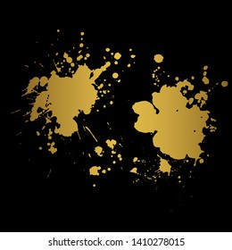 Golden Ink blot splashing on black background. A drop of ink, diffuse spots.