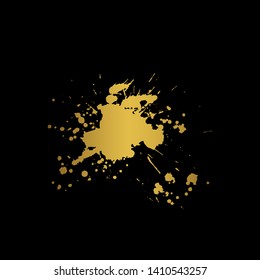 Golden Ink blot splashing on black background. A drop of ink, diffuse spots.