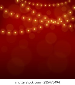 Golden led Christmas lights garlands on red background