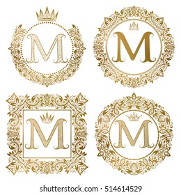 Golden letter M vintage monograms set. Heraldic coats of arms, round and square frames.