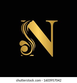 Golden letter N. Gold flower alphabet.  Beautiful golden capital letters with shadow