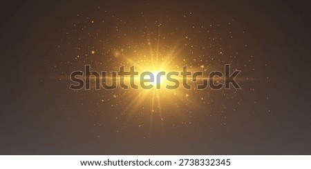Golden light bursting with sparkling particles creating an abstract lens flare effect