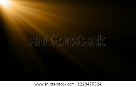 Golden light ray or sun beam vector background. Abstract gold light flash spotlight backdrop with golden sunlight shine on black background
