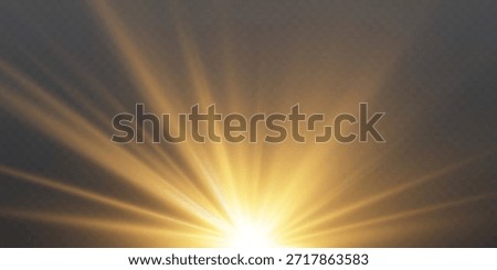 Golden light rays shining down on dark background