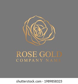 Golden line rose flora icon, yellow cosmetic logo design. Brand shiny gold flower shape symbol isolated on gray background.