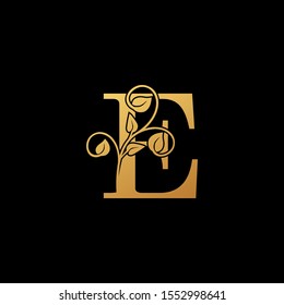 Golden  logo icon letter E.  Vintage design concept nature classy gold monocrome floral with letter logo icon on black background color  best for luxury, boutique,restaurant, wedding service, hotel.