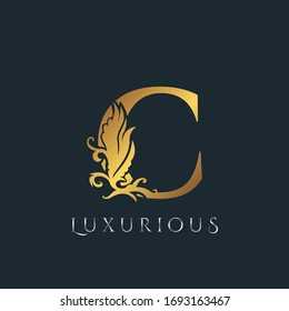 Golden Luxurious Initial Letter C Logo, Vector design ornate swirl nature floral concept for luxury brand identity.