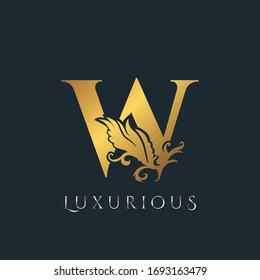 Golden Luxurious Initial Letter W Logo, Vector design ornate swirl nature floral concept for luxury brand identity.