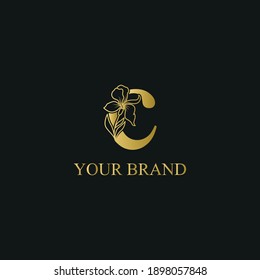 Golden Luxury Initial letter c with February Iris flower for cosmetic, Jewelry, boutique, hotel logo concept vector	