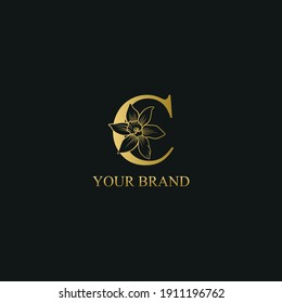 Golden Luxury Initial letter C with March Daffodils narcissus flower for cosmetic, Jewelry, boutique, hotel logo concept vector