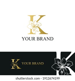 Golden Luxury Initial letter K with February Iris flower for cosmetic, Jewelry, boutique, hotel, resort, florist, beauty spa salon logo concept vector	