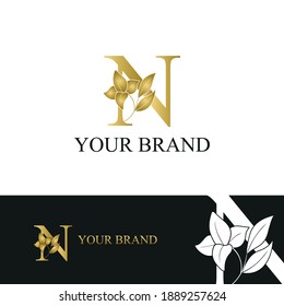Golden Luxury Initial letter N with flower for cosmetic, boutique, hotel logo concept vector