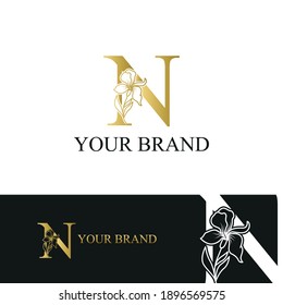 Golden Luxury Initial letter N with February Iris flower for cosmetic, Jewelry, boutique, hotel logo concept vector