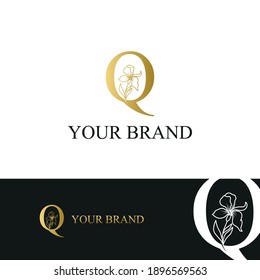 Golden Luxury Initial letter Q with February Iris flower for cosmetic, Jewelry, boutique, hotel logo concept vector