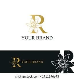 Golden Luxury Initial letter R with March Daffodils narcissus flower for cosmetic, Jewelry, boutique, hotel logo concept vector