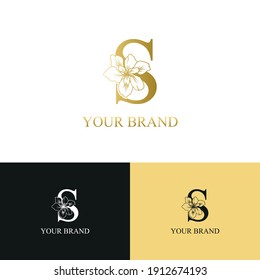 Golden Luxury Initial letter S with February Iris flower for cosmetic, Jewelry, boutique, hotel, resort, florist, beauty spa salon logo concept vector	