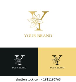 Golden Luxury Initial letter Y with March Daffodils narcissus flower for cosmetic, Jewelry, boutique, hotel logo concept vector