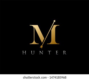 Golden M Letter Logo with arrow. vintage M logo design created from letter with arrow shape in gold color.