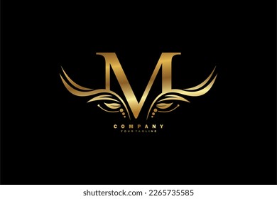 Golden M letter logo design with wing shaped feather ornament. monogram emblem, typography logo. initial letter.suitable for logos of business, boutique, company, fashion, hotel, etc