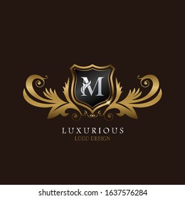 Golden  M Logo Luxurious Shield, creative vector design concept for luxury business indentity.