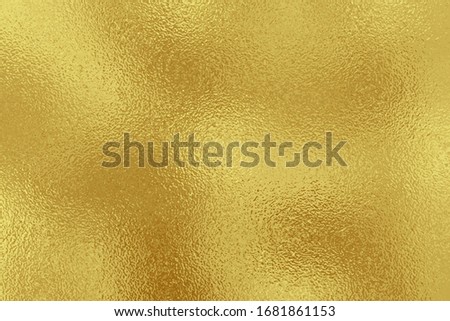 Golden metallic effect. Texture shine foil. Background with glitterer metal effect. Gold surface. Backdrop glitter gold metal plate. Metallic golden texture foil for design invitation, cards, prints