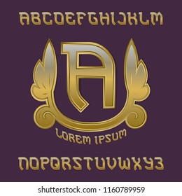 Golden monogram template in imperial laurel wreath with gaming stylized alphabet.