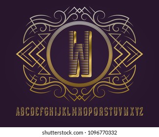 Golden monogram template in round patterned frame with ribbed alphabet.