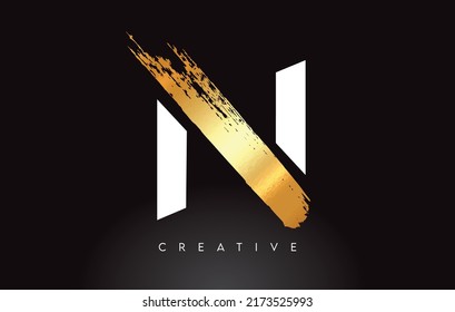 Golden N Letter Logo with Brush Stroke Artistic Look on Black Background Vector Illustration.