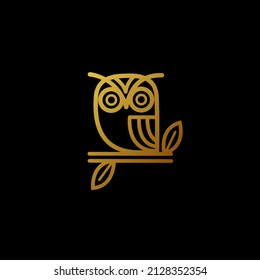 golden owl logo on black background