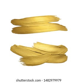 Golden paint brush strokes on white background. Vector illustration. Gold yellow paint vector textured abstract brushes set.