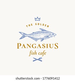 Golden Pangasius Abstract Vector Sign, Symbol or Logo Template. Hand Drawn Basa Fish with Classy Retro Typography. Crown, Fork and Knife Icon. Restaurant or Cafe Vector Emblem. Isolated.