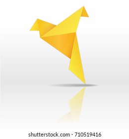 Golden paper bird on white background